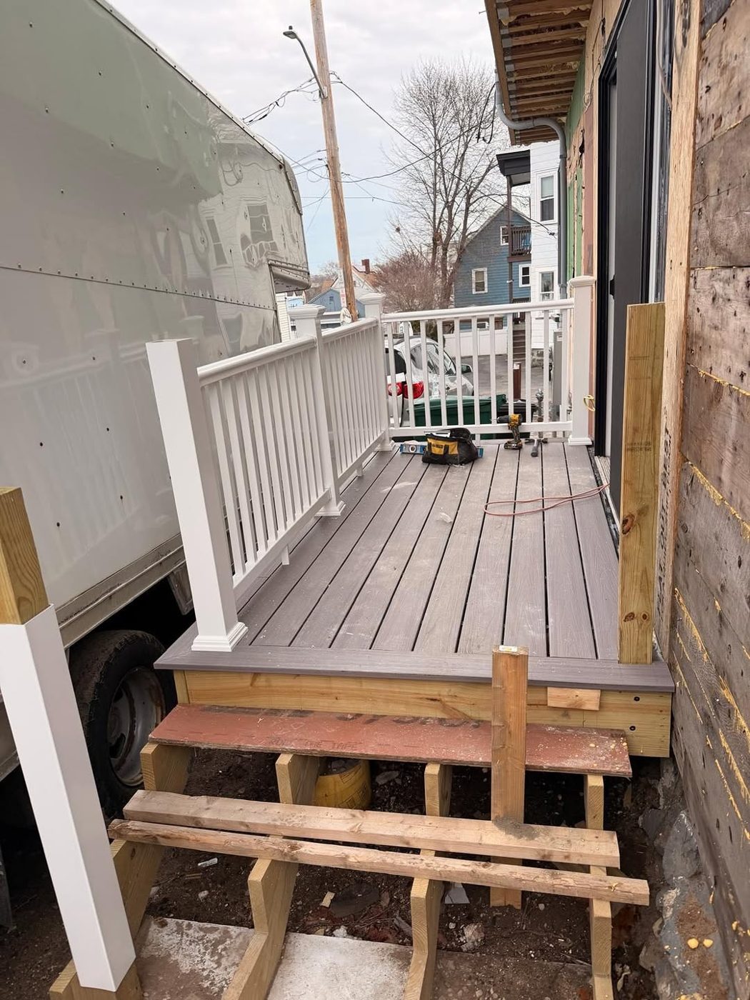 New porch deck with white railing