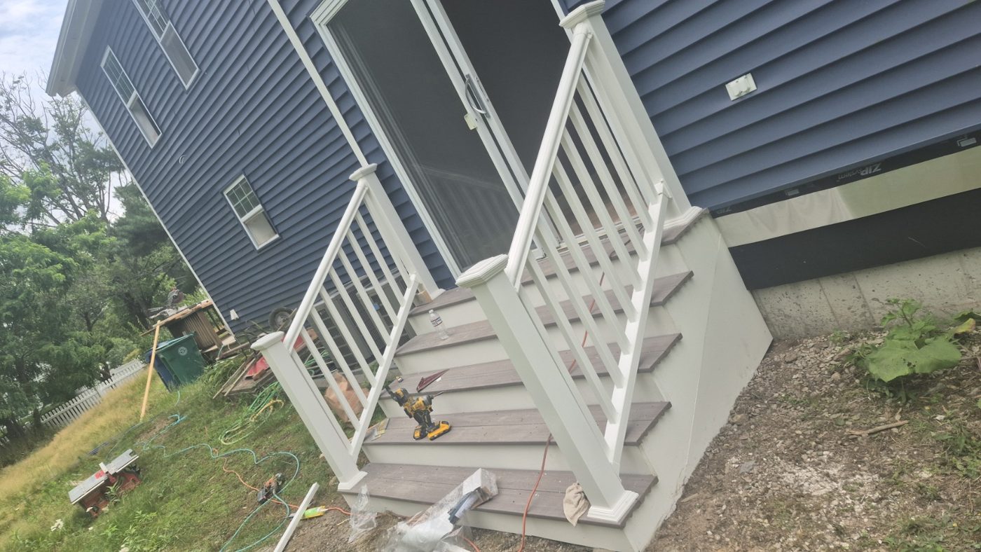 Porch stairs with white railings