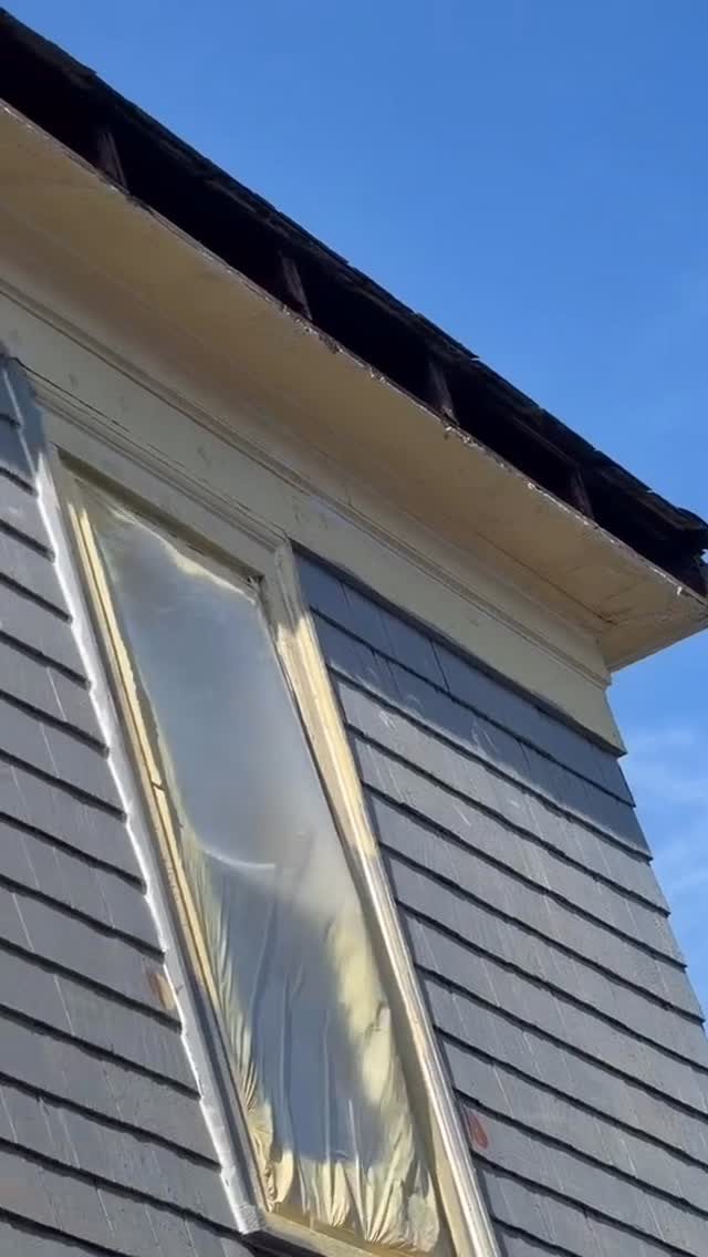 New siding and window on a gray house